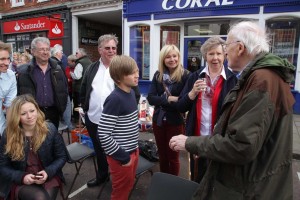 Typical John! Bumps into folks he vaguely knows and he is off, chatting away! Street party, 2012